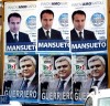 due manifesti allineati, uno del candidato Marco Mansueto (pdl), l'altro del candidato Salvatore Guerriero (PD)